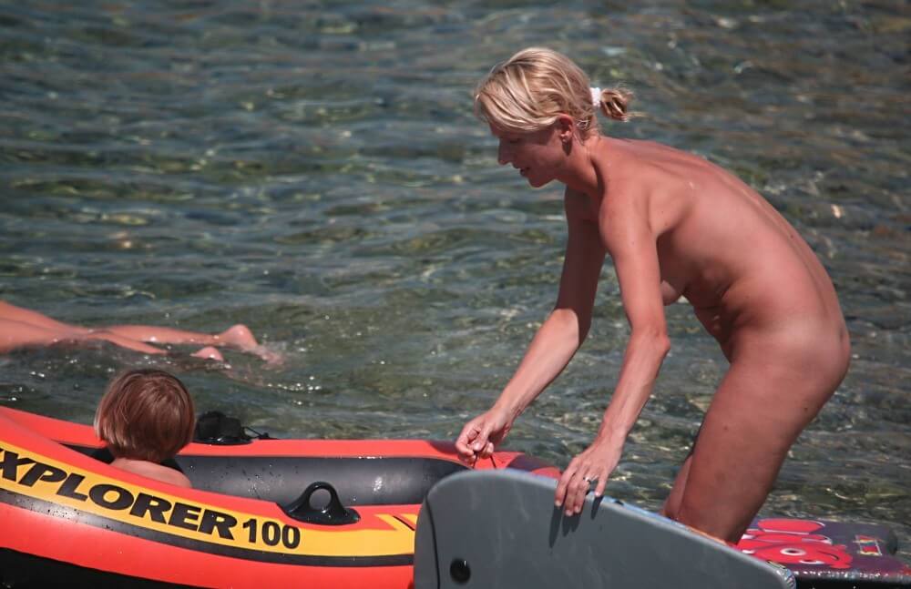 Red Boating for Two Nudists pics - A defining feature of naturism is the absence of clothing