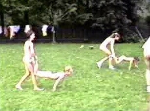 A nudist gathering at the stadium and sports - A love of the sun and fresh air are important values for those who practice naturism and nudism