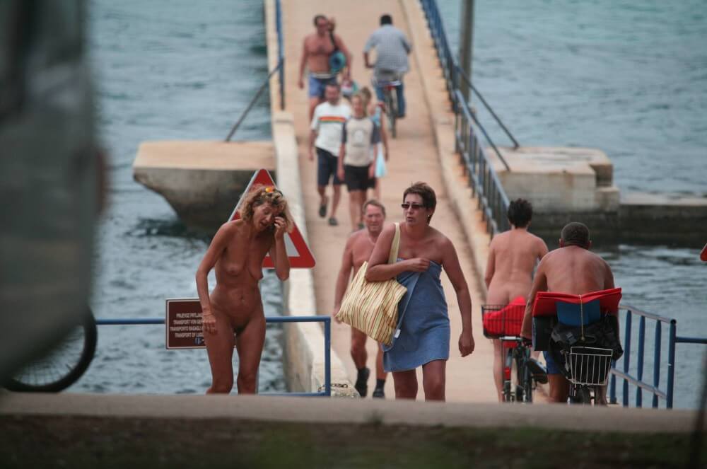 Crete FKK Bridge Crossing photos - Nudity is seen as a natural part of life among nudists