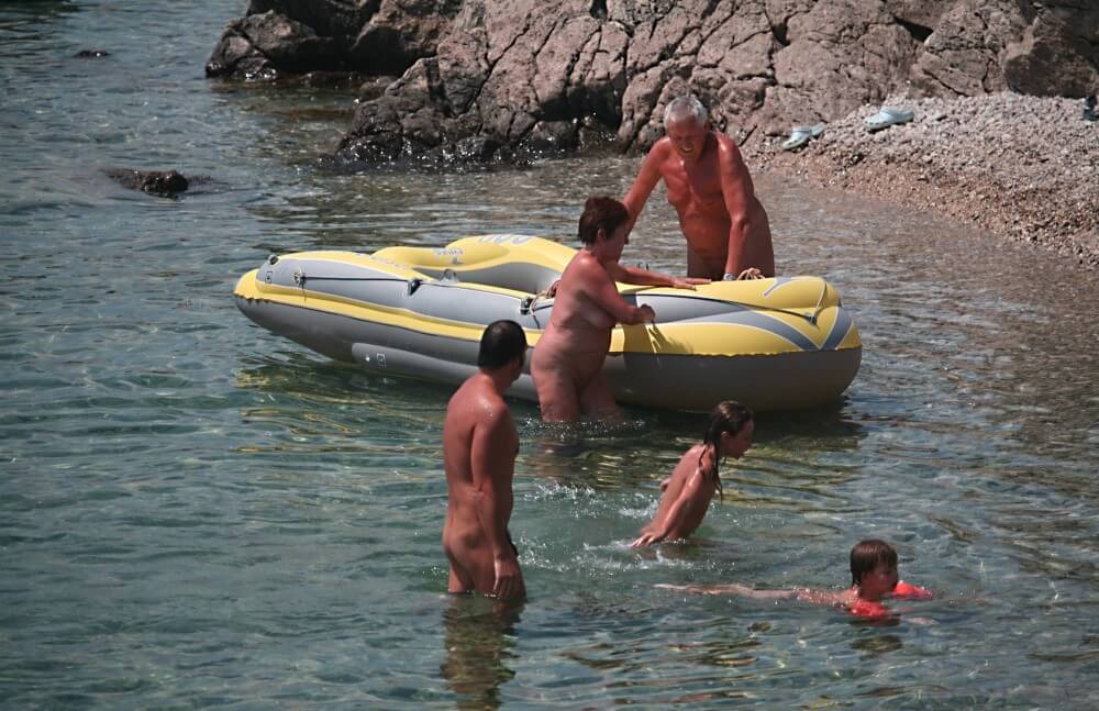 Lone Nudist in Yellow Boat photos - Being oneself is the foundation of nudism